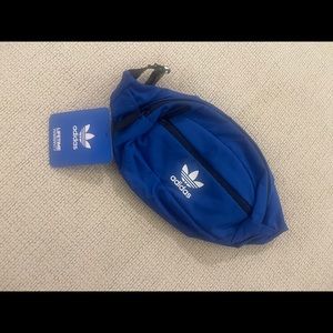 Adidas royal blue Fanny pack with black strap.